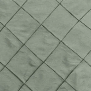 Sage green pintuck fabric with diamond-shaped textured pattern for event linen rentals.