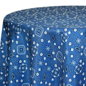 Blue paisley-printed tablecloth with white floral and geometric design details.