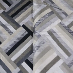 Gray geometric herringbone pattern fabric with textured linear design in neutral tones.