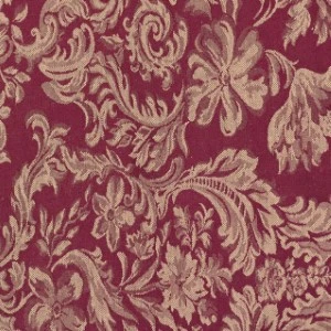 Rich burgundy damask fabric with ornate gold floral and scrollwork pattern for elegant event linens.