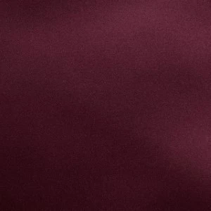 Solid burgundy wine-colored fabric surface with subtle gradient and smooth texture.