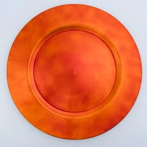 Burnt orange charger plate with metallic sheen and smooth circular design for event tableware.