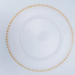 Delicate white china plate with gold beaded rim and elegant circular design.