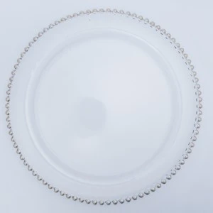 Decorative white porcelain charger plate with pearl-like beaded border for elegant table settings.