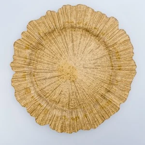 Gold textured charger plate with radial sunburst design and scalloped edge for elegant table decor.