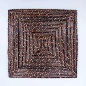 Dark brown woven square rattan placemat with intricate diagonal weave pattern.