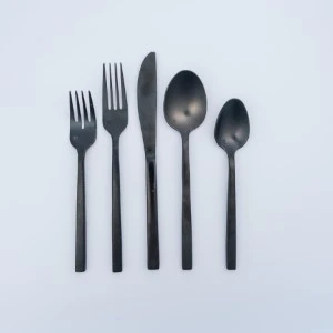 Five sleek black flatware utensils arranged vertically against a light blue background.