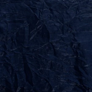 Navy blue textured fabric with deep wrinkled surface and rich, dark indigo coloration.