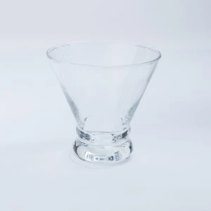 Clear glass stemless cocktail martini glass with wide mouth and sturdy round base.