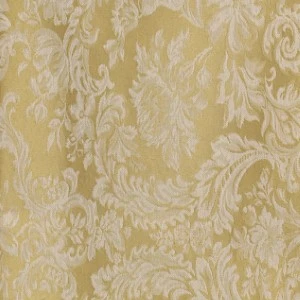 Soft gold damask fabric with elegant floral scrollwork and textured jacquard pattern.