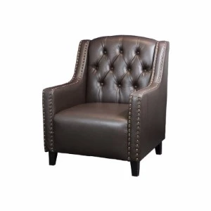 Brown leather tufted armchair with nailhead trim and button details for event seating.