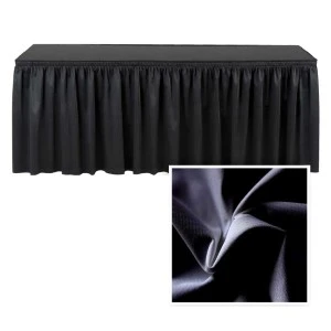 Black pleated table skirt with soft fabric draping and textured close-up detail.