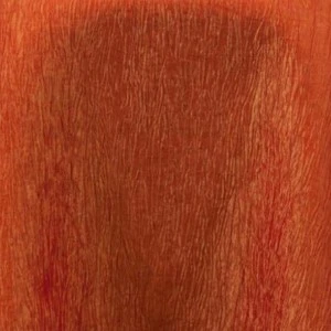Rich rust-red wooden surface with fine vertical grain texture and warm auburn tones.