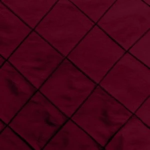 Deep burgundy pintuck fabric with diagonal black grid pattern for event linen rentals.