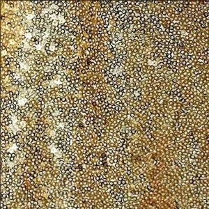 Shimmering gold and bronze sequin fabric with dense, textured mosaic-like surface for glamorous event decor.