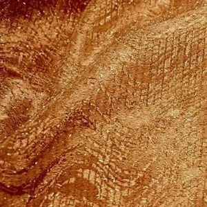 Golden-brown textured fabric with intricate wavy lines and rich, warm woodgrain-like texture.