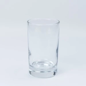 Clear glass tumbler with sturdy base, transparent cylindrical design for event beverage service.