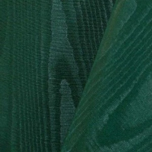 Dark emerald green fabric with subtle vertical ribbed texture and soft folds.