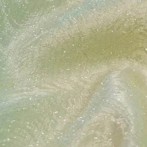 Pale green and cream textured fabric with shimmery, soft watercolor-like swirling patterns.