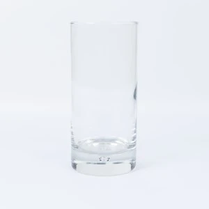 Clear tall glass tumbler with thick base, transparent cylindrical shape for event bar rental.