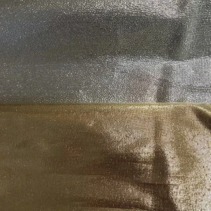 Metallic silver and gold shimmering fabric with textured, reflective surface for event linens.