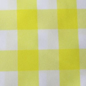 Yellow and white checkered gingham fabric linen with textured woven pattern for event rentals.