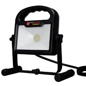 Black portable LED work light with sturdy stand and power cord for job site illumination.