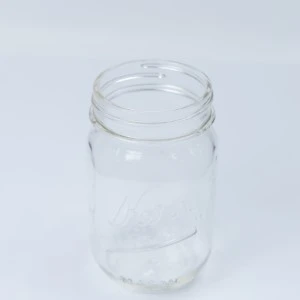 Clear glass mason jar with smooth sides and wide-mouth opening for event rentals.