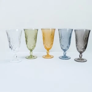 Five vintage-style textured glass goblets in pastel colors, ranging from clear to gray.