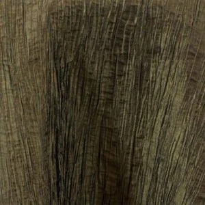 Weathered wood-grain textured surface in muted olive and gray tones with linear vertical striations.