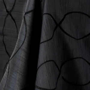 Dark charcoal gray fabric with curved linear texture and subtle geometric overlay pattern.