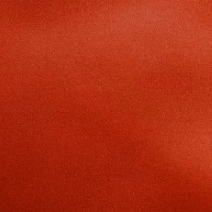 Solid rust-red fabric with smooth texture and uniform color for event rentals.