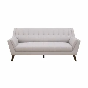 Light gray tufted sofa with angled arms and tapered wooden legs for event seating.