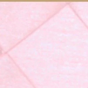 Soft pink textured fabric with diagonal pleats and wrinkled surface for event decor.