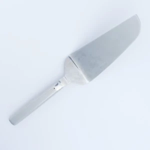 Stainless steel cake server with sleek handle and triangular blade for event tableware.