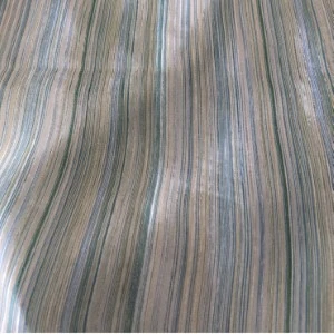 Soft blue-gray striped fabric with vertical wavy texture for event linen rentals.