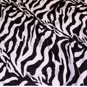 Black and white zebra-print fabric with wavy striped pattern for event linens.