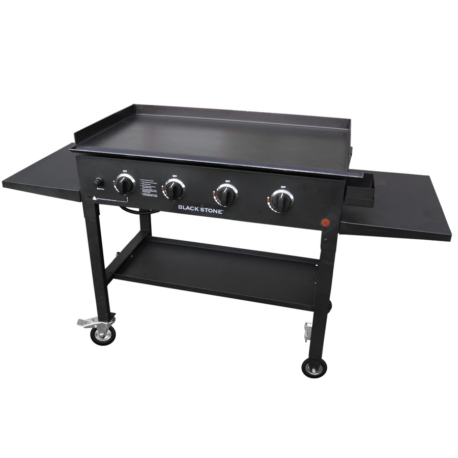 Black Blackstone griddle with four burner controls on wheeled metal stand with side shelves.