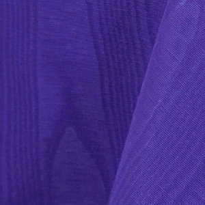 Purple pleated fabric with soft vertical folds and textured ripple effect for event linens.