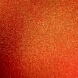 Solid burnt orange textured fabric with subtle grainy surface and rich, warm color gradient.