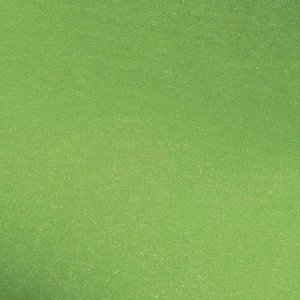 Solid light green fabric with soft matte texture and uniform color for event linens.