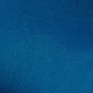 Solid deep blue textured fabric background with subtle gradient and rich marine color.