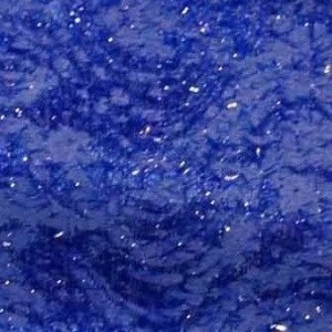 Deep blue lapis lazuli-like textured fabric with sparkling crystalline highlights and rich sapphire tones.