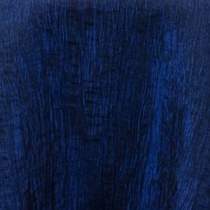 Deep navy blue textured fabric with vertical ribbed pattern for event linen rentals.