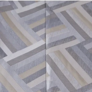 Gray and white geometric patterned linen with angular, overlapping rectangular design.