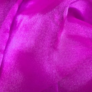 Magenta metallic fabric with shimmering, crinkled texture for event linen rentals.