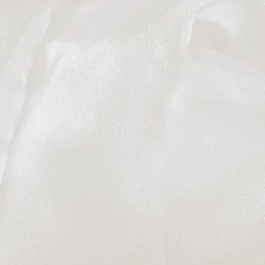 Soft white fabric with delicate wrinkles and gentle folds, creating a textured neutral backdrop.