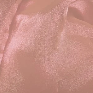 Blush pink sheer fabric with soft, silky texture and delicate metallic shimmer for elegant event linens.