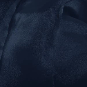 Deep navy blue fabric with soft folds and smooth, luxurious texture for elegant event linens.