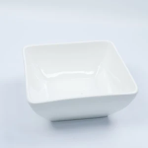 Square white ceramic serving bowl with smooth, minimalist design and raised edge.